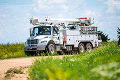 Photo of an Evergy truck driving to restore power