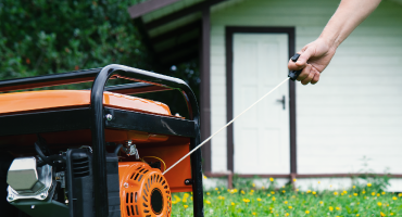 Person using a generator outside