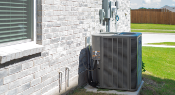 a heating and cooling unit outside of a house